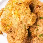 AIR FRYER CHICKEN TENDERS cooked and served on a plate with dipping sauce