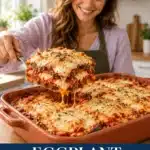 Eggplant Parmesan with tomato sauce and melted cheese in a terracotta baking dish, with a portion lifted on a serving spatula